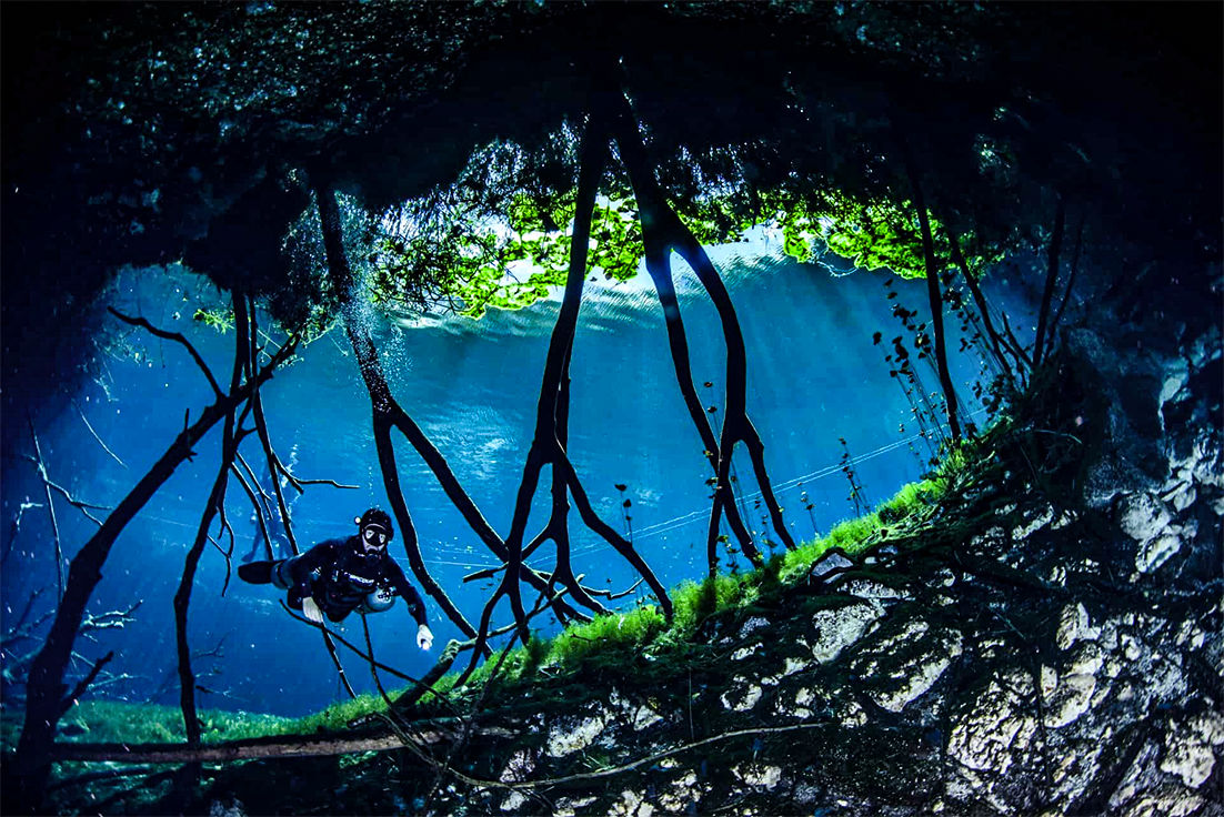 A begins his descent into Cenote Carwash