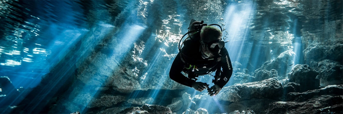 Diver begins descent into a cavern