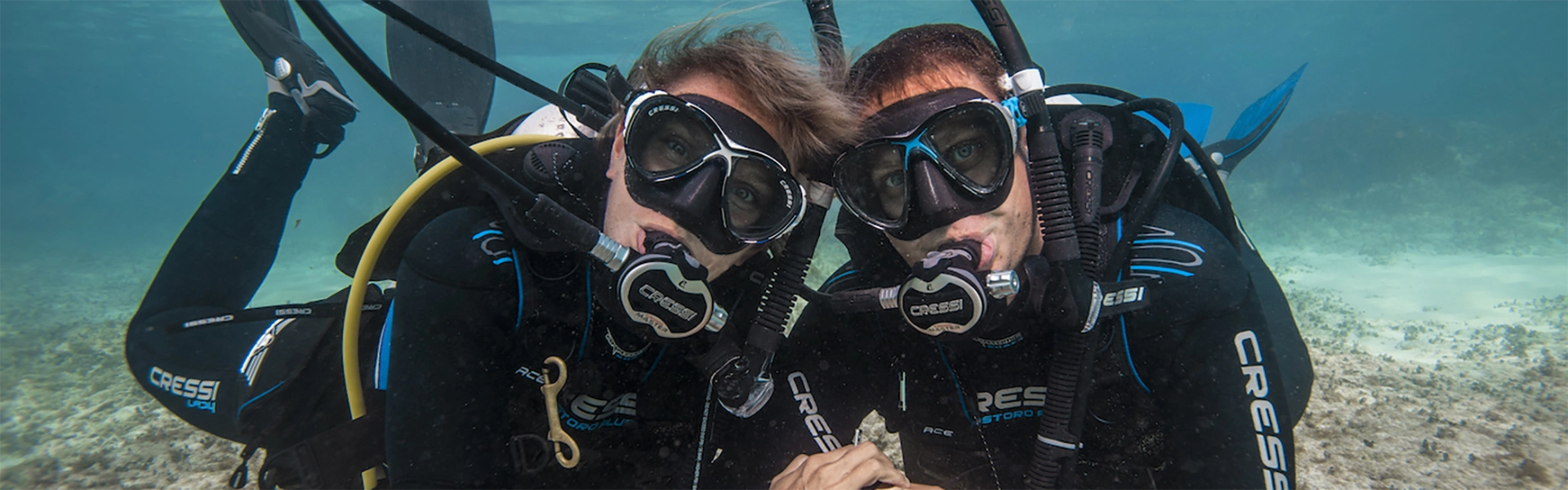 Couple pose for photo on their first dive