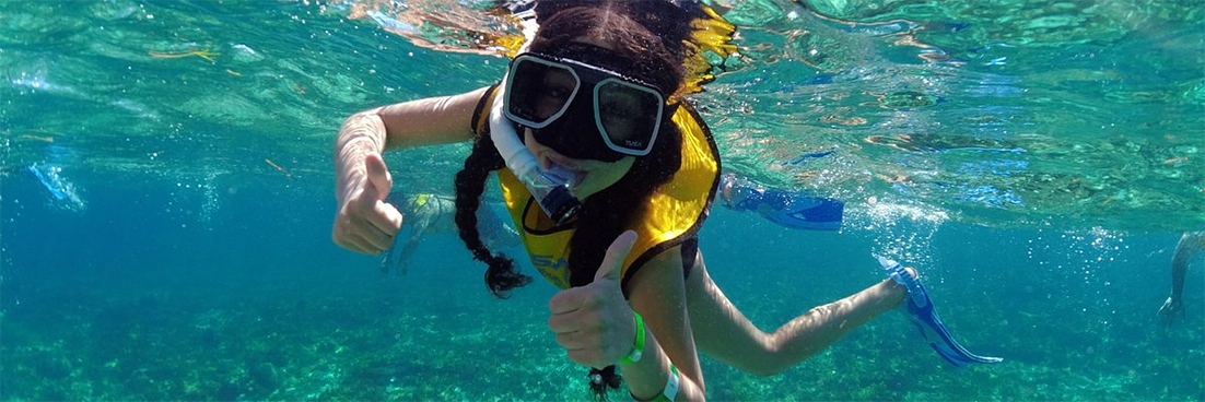 Snorkeler gives us a thumbs up.