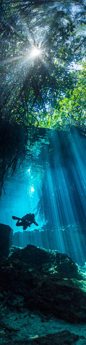 View of diver swimming in Casa Cenote