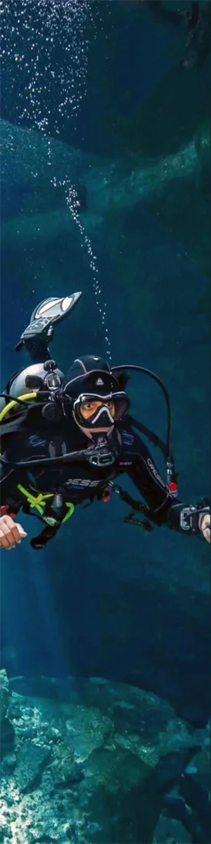 Diver swims through Tajma Ha light display