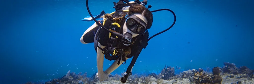 Diver floats over Paridisio Reef in Cozumel