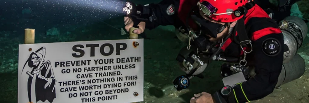 Cave divers admire rock formations