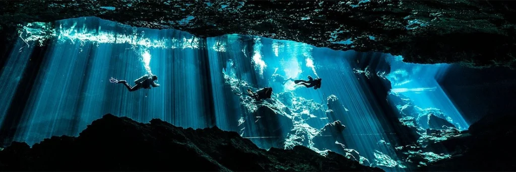 Divers return to the entrance of Chac Mool Cenote